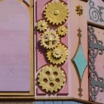 Three gears form a hidden Mickey on the outside of It's a Small World.